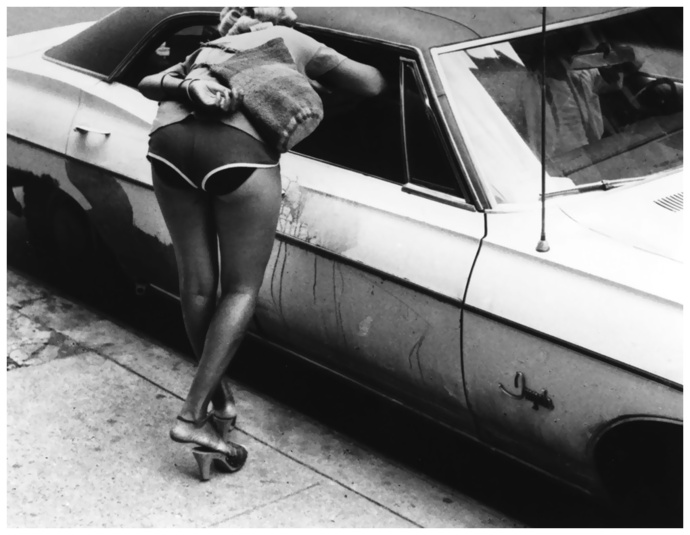woman-in-shorts-leaning-into-window-of-parked-car-new-york-city-1970s-photo-by-leon-levinstein